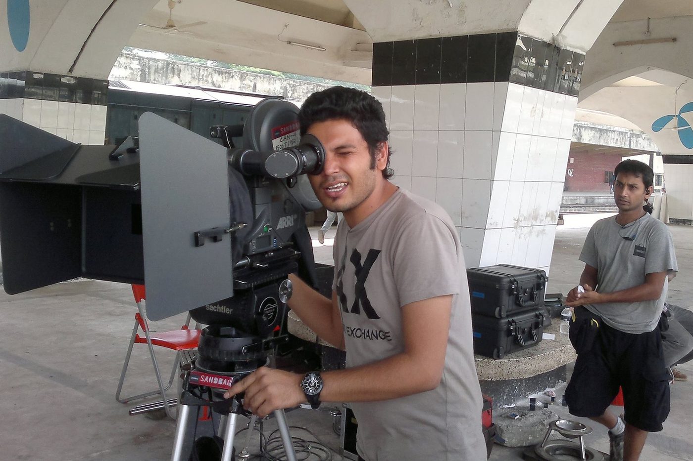 Cinematographer framing the shot on location
